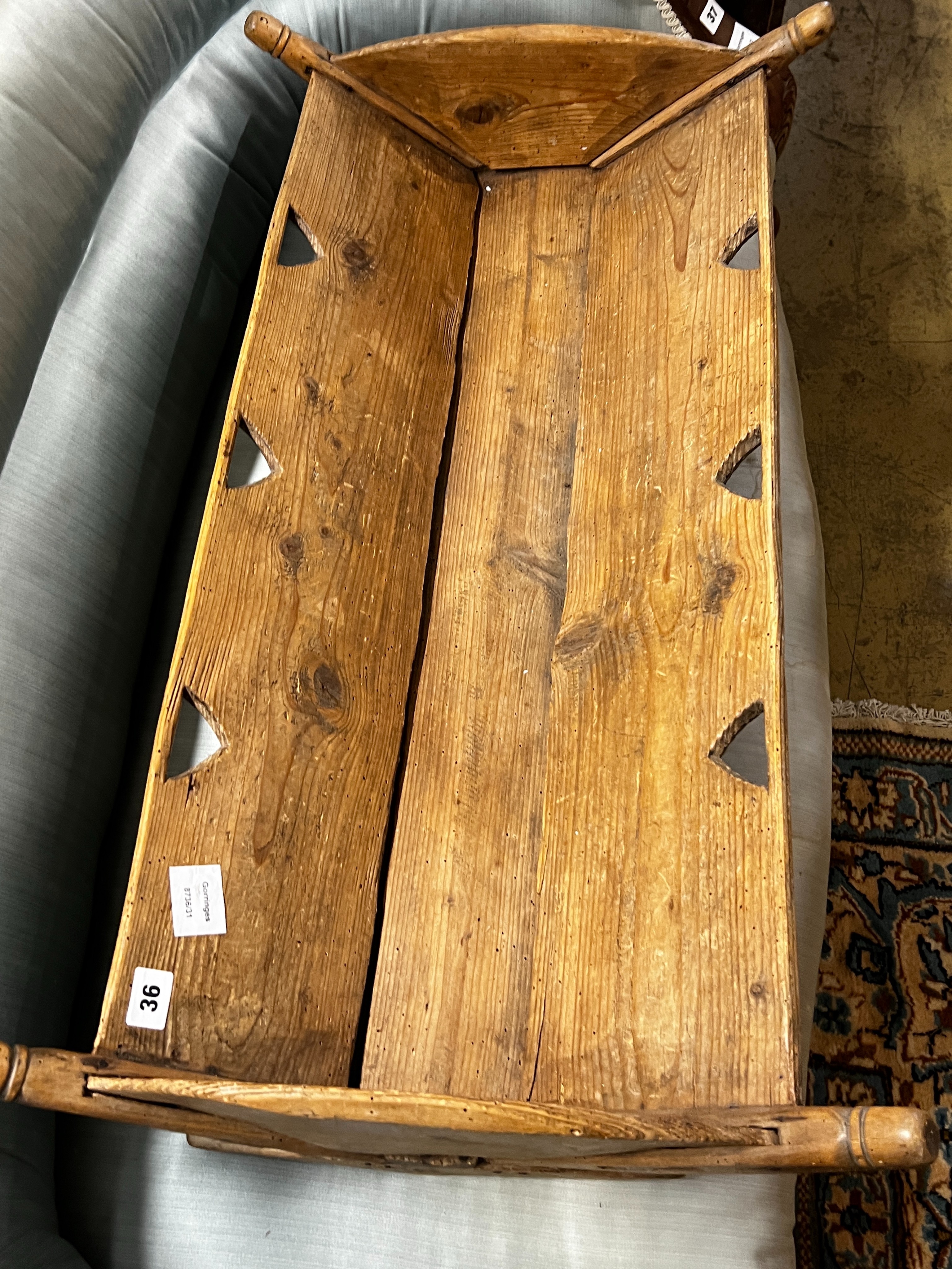 A 19th century French pine rocking crib, length 87cm, depth 48cm, height 18cm